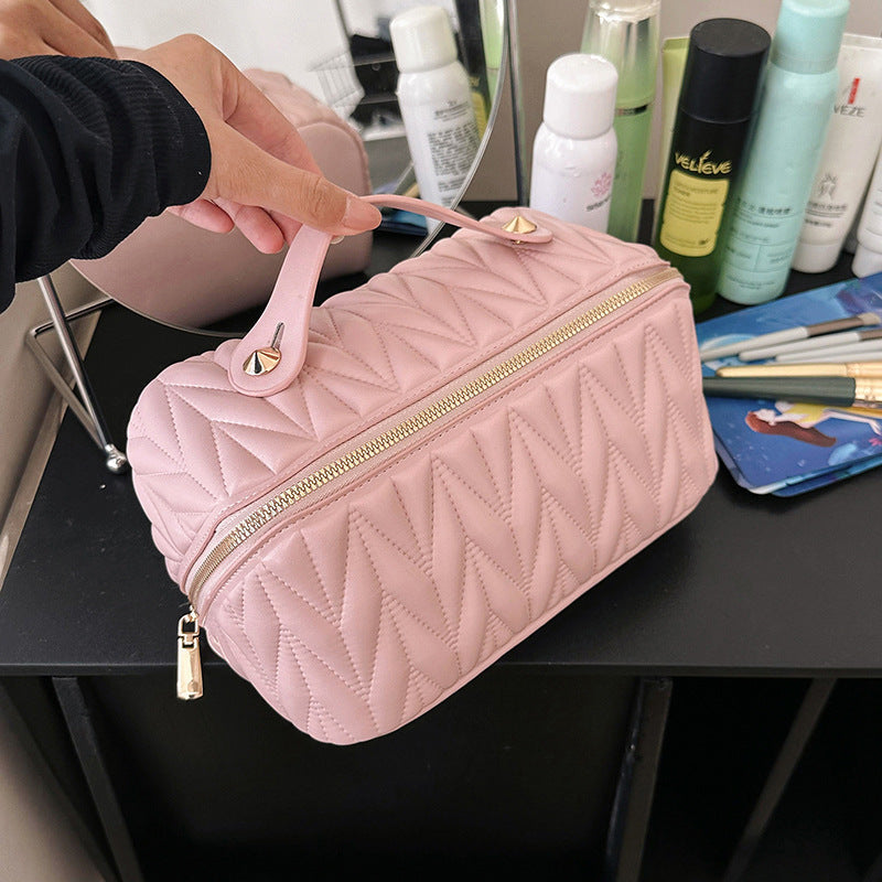 Pink PU travel cosmetics bag with embossed pattern