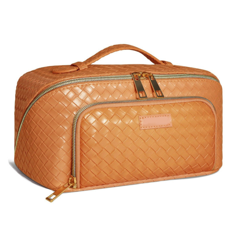 Large PU cosmetics bag with woven design and sturdy zipper, ideal for organizing beauty essentials.