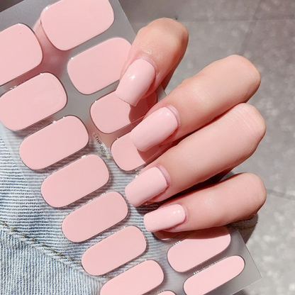 THE SOLID 10-DAY nail stickers in soft pink shade on hand.